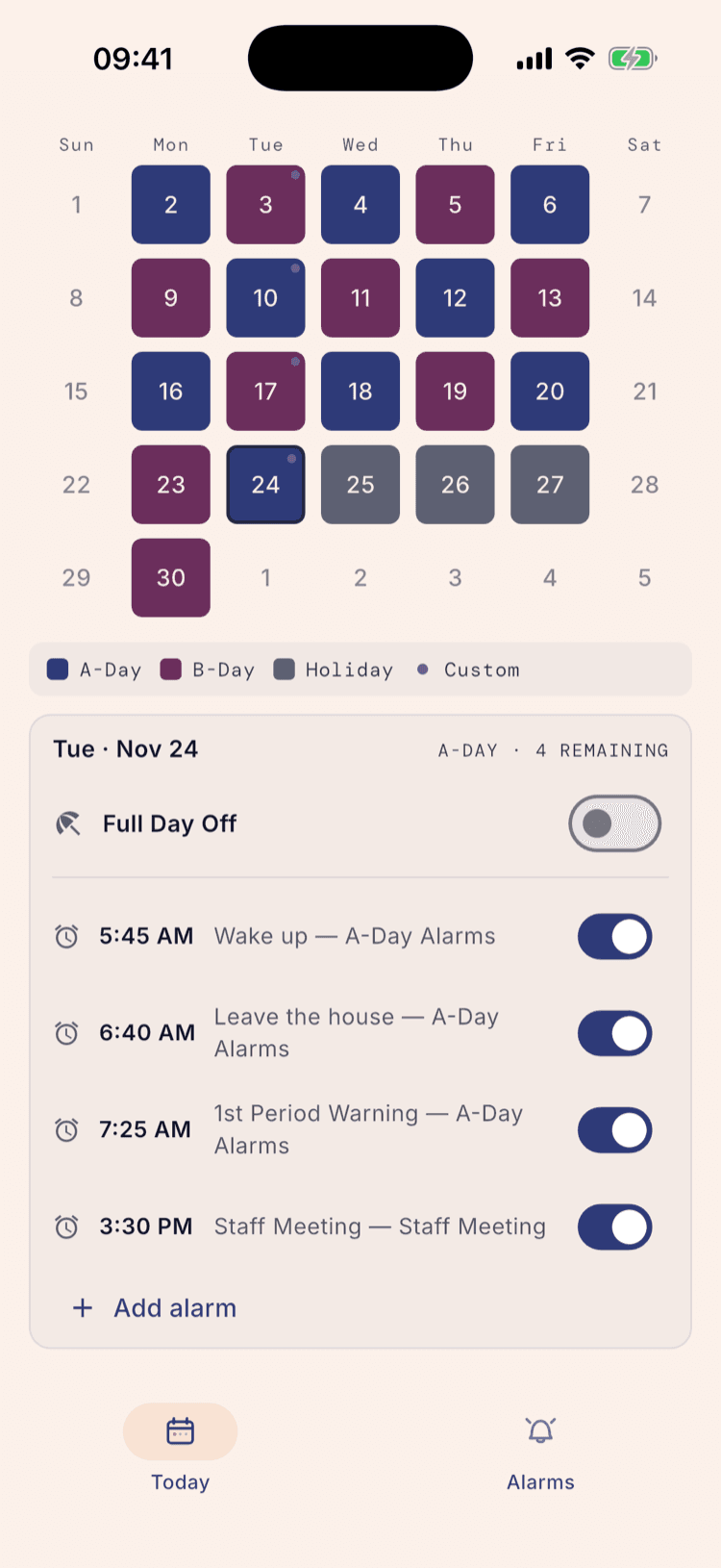 November 2026 with a small dot in the corner of every Tuesday, the 24th selected, and the panel below reading “Tue · Nov 24 — A-DAY · 4 REMAINING” above three A-Day Alarms and a 3:30 PM Staff Meeting from the Staff Meeting group.